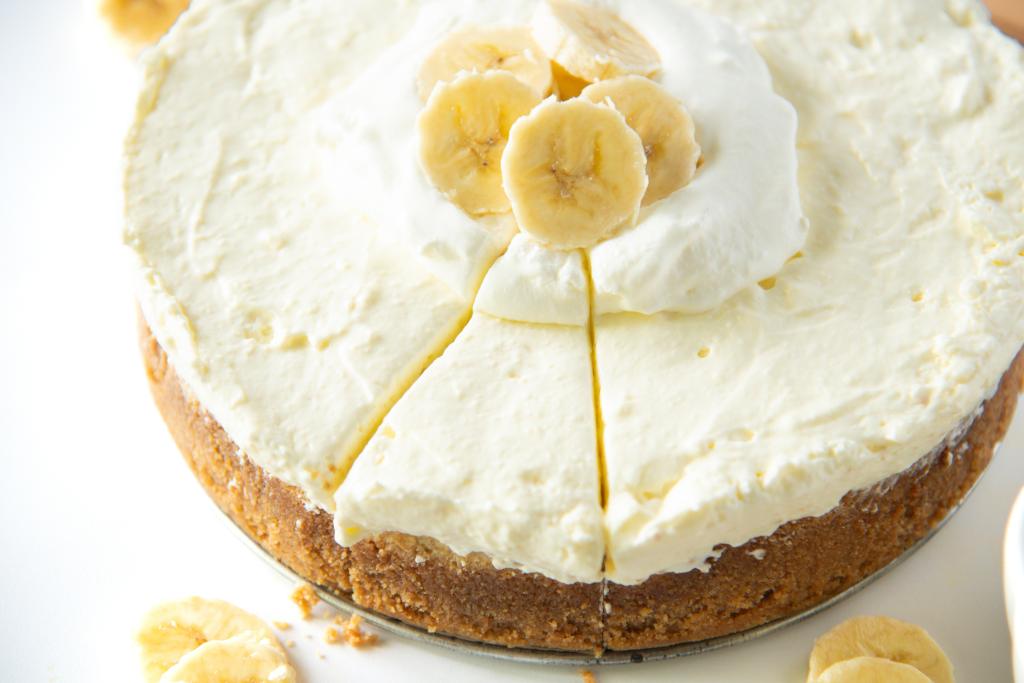 a close up of a cheesecake that has been sliced 