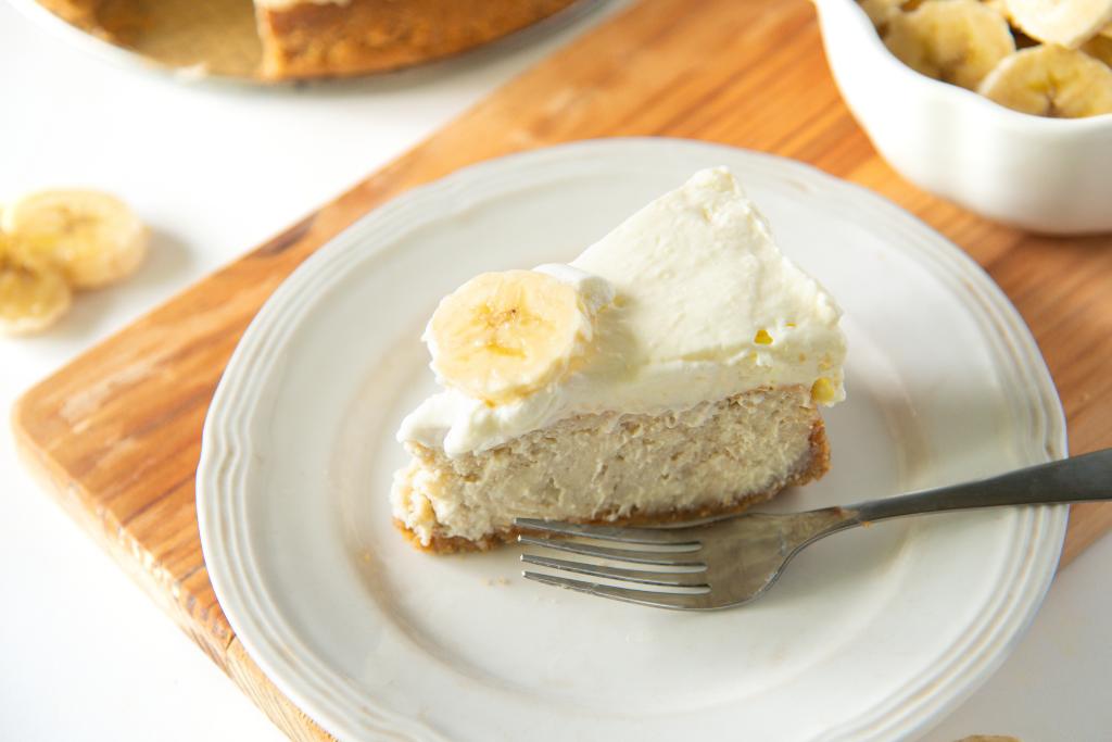 a slice of banana cheesecake on a plate with a fork
