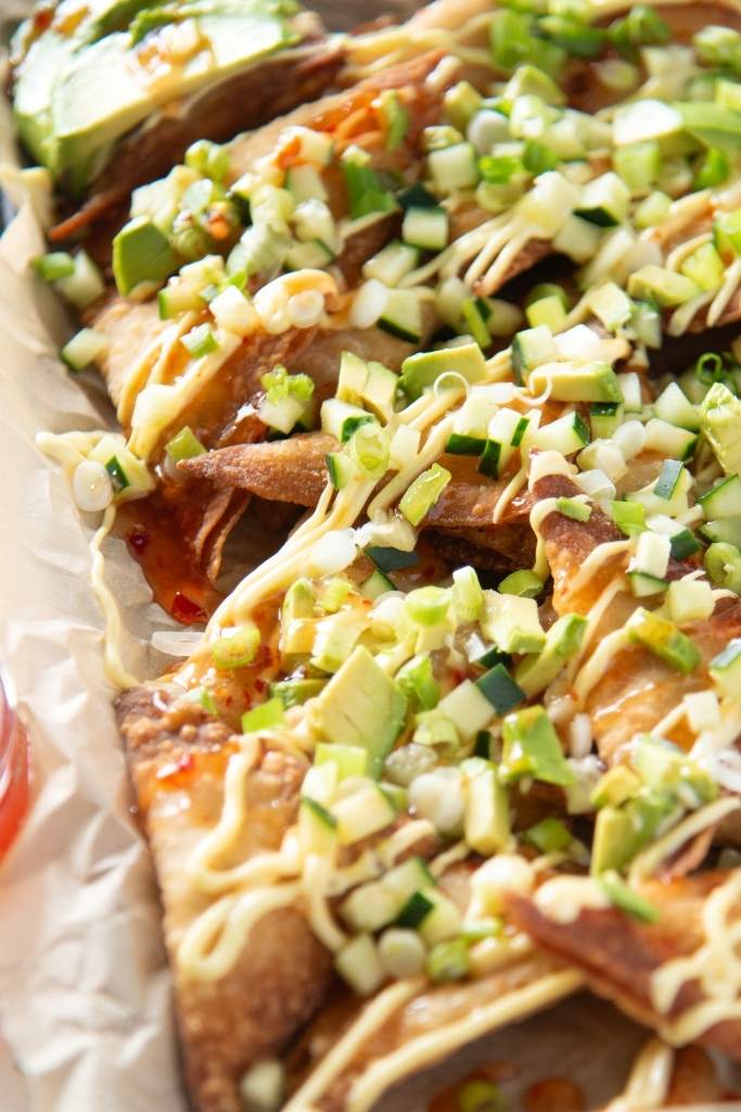 a close up of a tray of rangoon nachos 