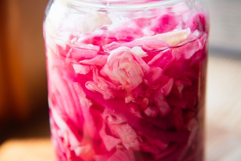 a jar of pickled cabbage and onions 
