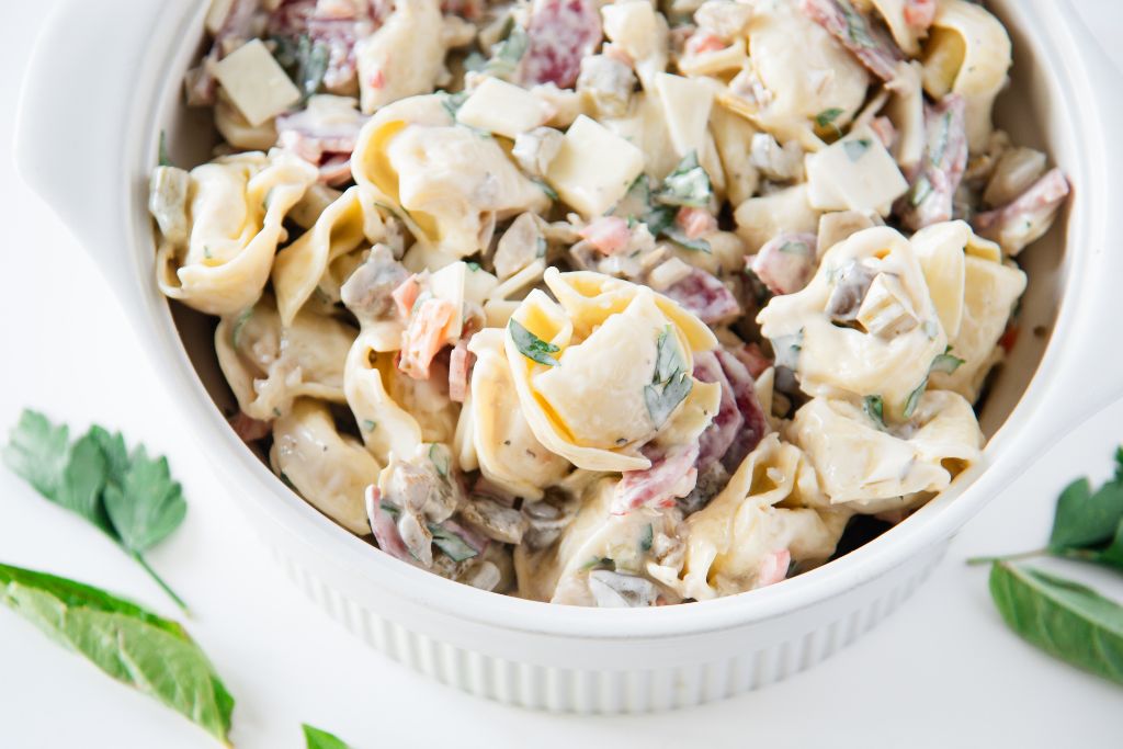 a close up of a bowl of pasta salad 