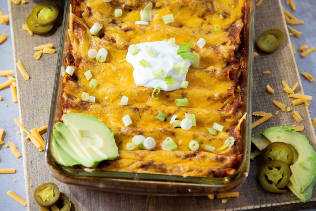 a close up of a pan of cheese enchiladas