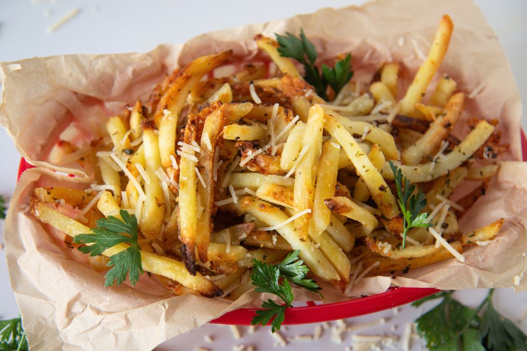 a basket of garlic parmesan fries